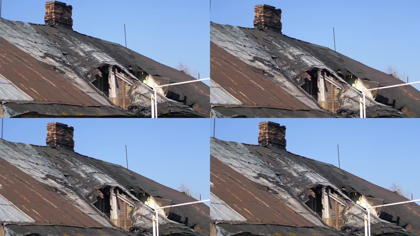 一个老旧的腐朽的木屋屋顶与烟囱的细节在4k慢动作60fps