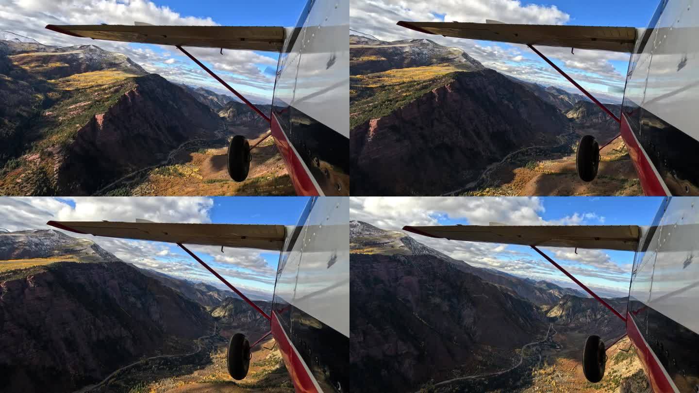飞机在风景优美的山脉中飞行的镜头