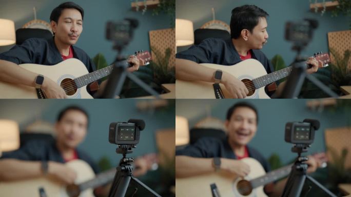 英俊的亚洲男子博主录制视频课教程，在家庭工作室的现代智能手机上弹吉他。