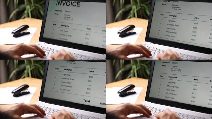 自由职业者在家办公室用笔记本电脑开发票。商业会计
