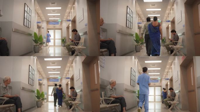 医院走廊的慢动作建立镜头，活跃的医生和护士在工作，病人和来访者在等待。现代印度诊所提供不同的医疗保健