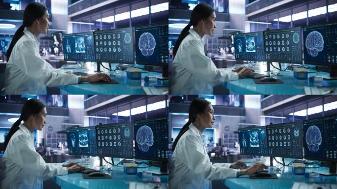 癌症研究中心医学实验室:亚洲女性神经科学家使用台式电脑分析人脑的CT扫描。专家研究脑肿瘤，寻找解决方