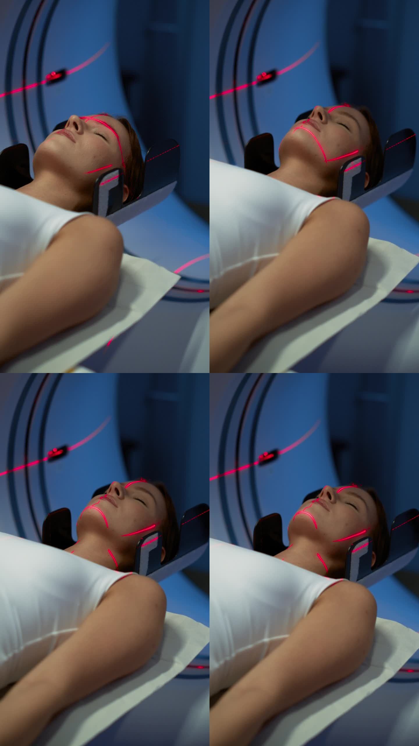 垂直屏幕:女性患者躺在CT或MRI扫描上的特写肖像，当机器扫描她的身体和大脑时，床在机器内部移动。拥