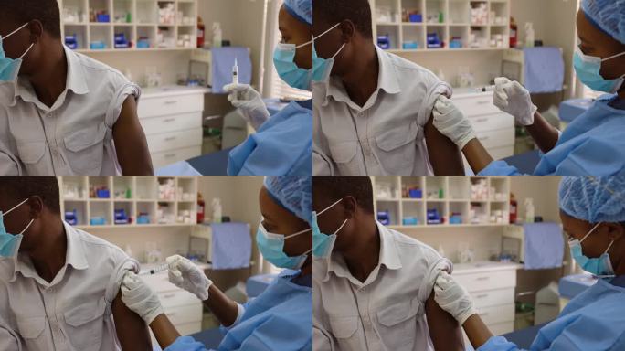 非洲黑人女护士在医生的房间里给非洲黑人男病人注射