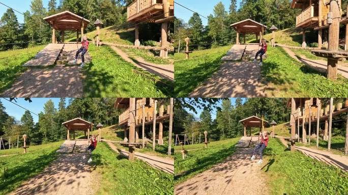 快乐的小女孩在游乐场的人猿泰山景点玩耍。小女孩们在夏季冒险公园里尽情玩耍和攀爬