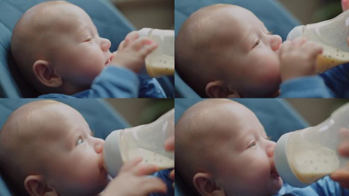 小男孩吸吮一瓶牛奶，小孩子吃，婴儿食品概念