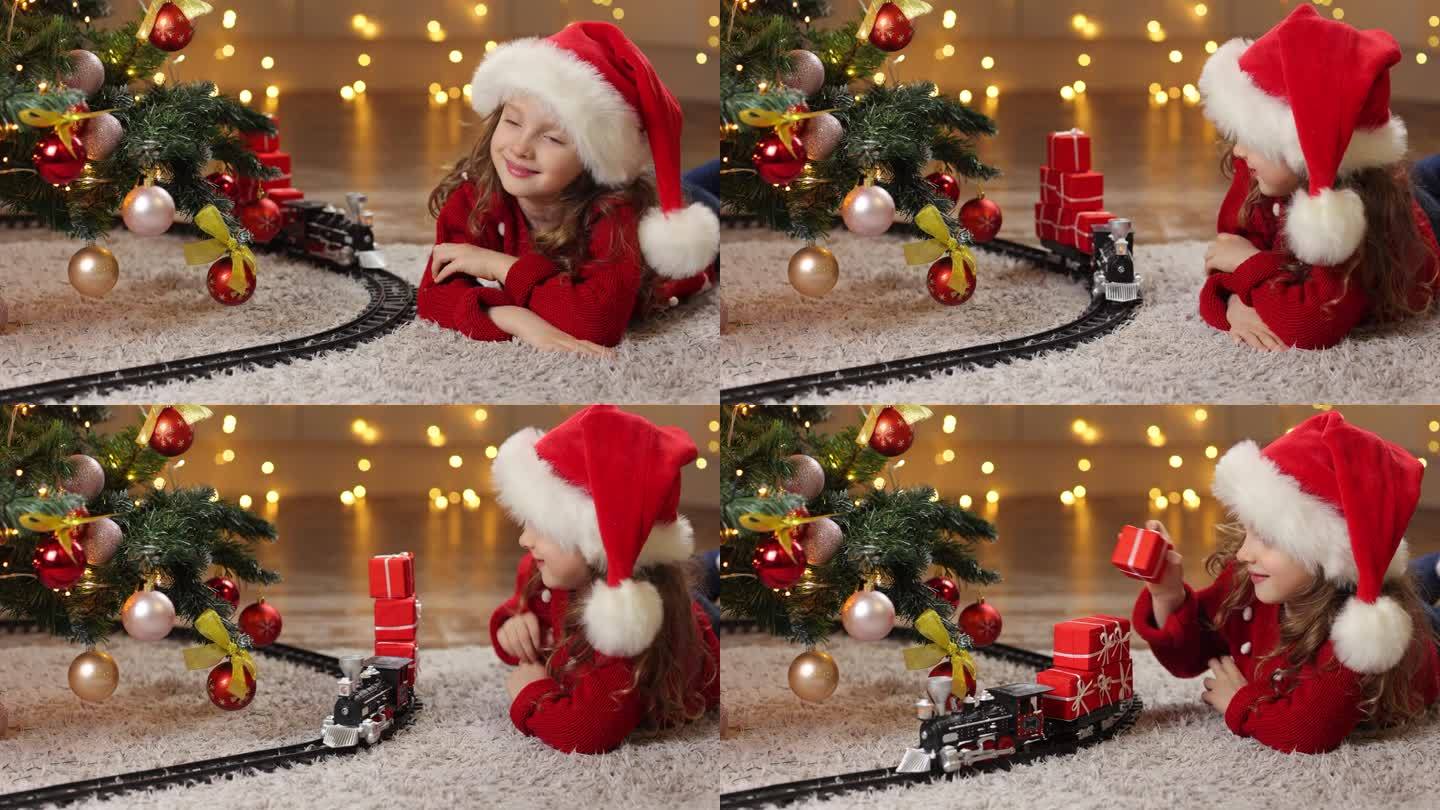 圣诞前夜，圣诞老人在火车上给一个孩子送礼物。圣诞树旁的小孩。