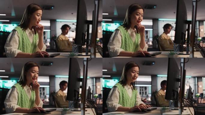 女性天才数字营销专家在现代办公室的电脑工作。年轻而成功的亚洲女商人在创意机构，微笑和研究商业分析数据
