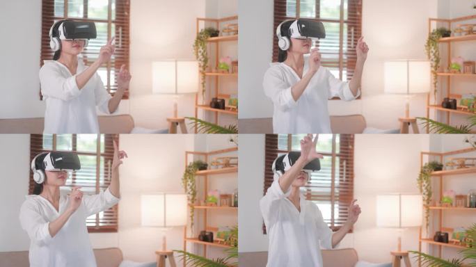 幸福的亚洲妇女画像，戴着虚拟现实眼镜，在家中移动双手