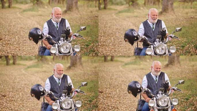 开朗的年长男性白种人骑摩托车，坐在摩托车上，用耳机通过视频通话打电话
