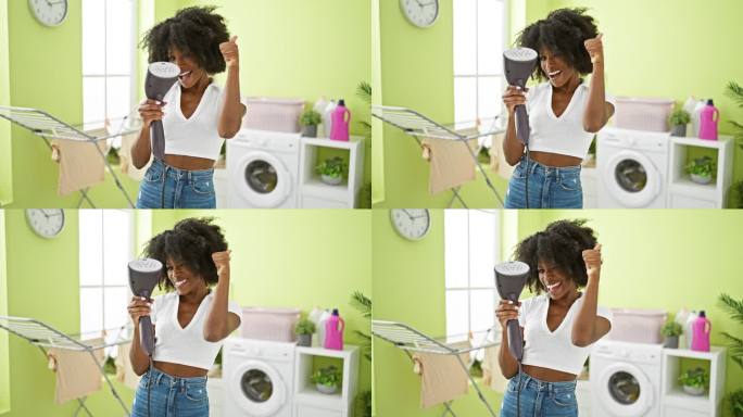 非裔美国妇女在洗衣房拿着立式熨烫机竖起大拇指