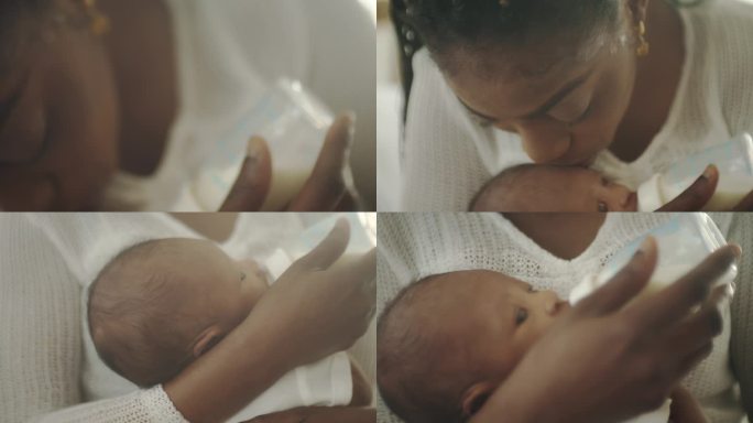 年轻的母亲正在给她刚出生的婴儿喂奶