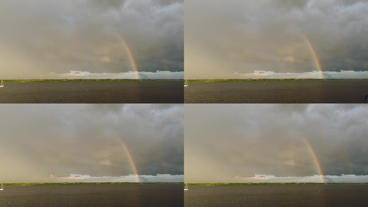 暴风雨过后的乌云显示出与乌云形成对比的彩虹
