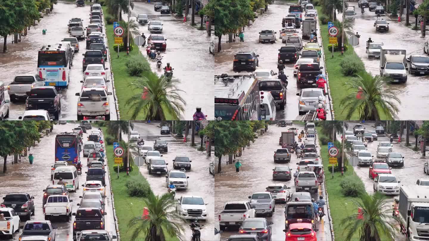 在被水淹没的道路上行驶的车辆。