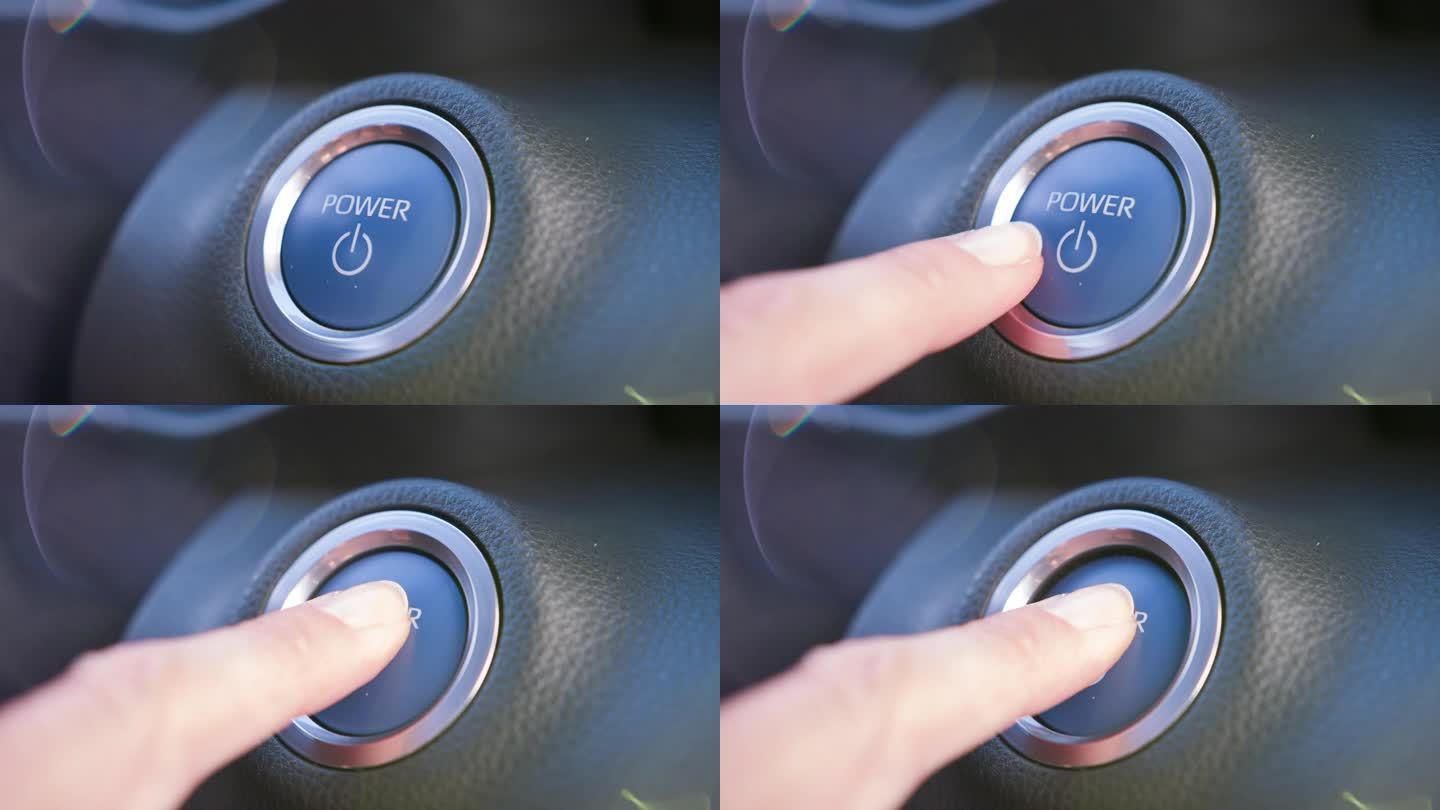 女人的手指按下了仪表盘上的汽车电源按钮