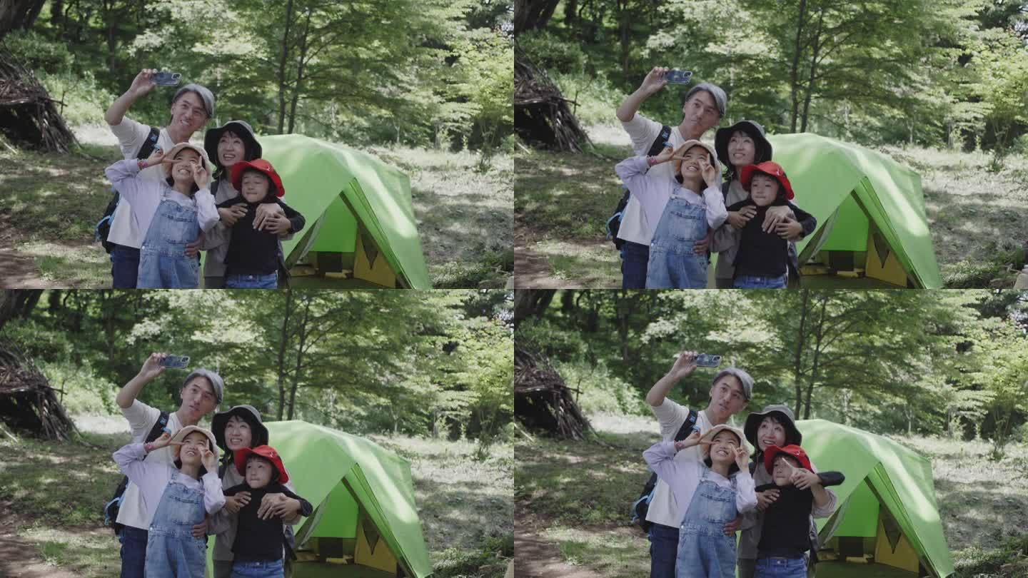 一个日本家庭在露营地自拍。