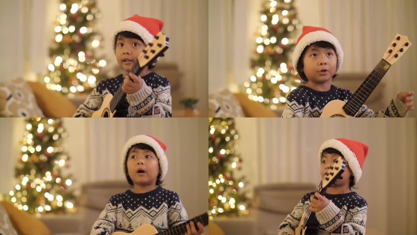 可爱的亚洲儿子在圣诞节与家人在客厅享受音乐
