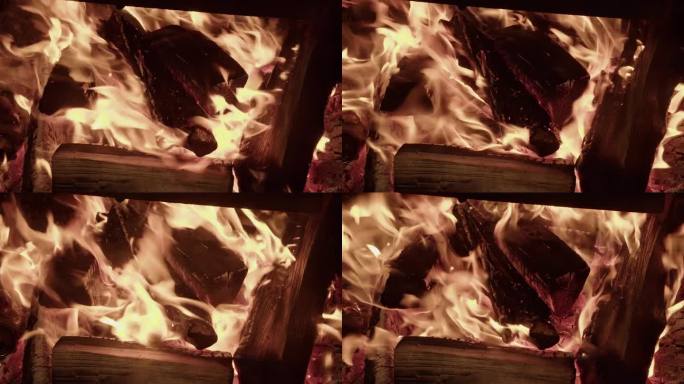 温暖的木柴燃烧的篝火从夜火中升起