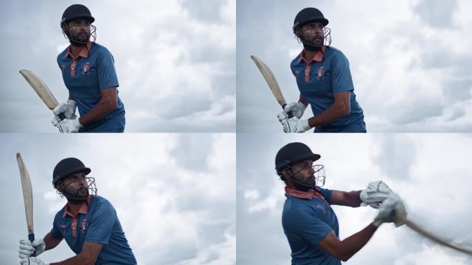 阴天的低角度慢动作镜头。一位印度板球运动员用球棒击球的肖像。蓝队击球手将球送到外场