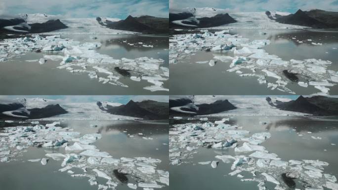 空中飞行的戏剧性的冰山漂浮在水中，Jokulsarlon湖，自然气候雪景，冰岛