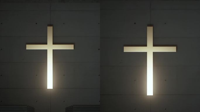 教堂的墙上装饰着一个发光的大十字架。