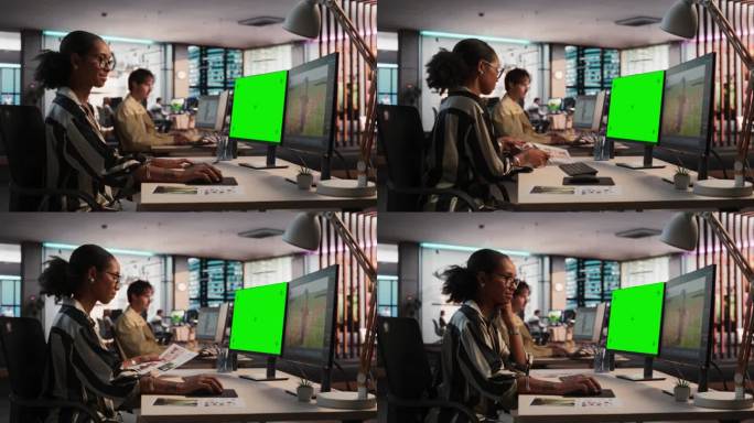 女性黑人游戏设计师使用桌面电脑绿屏Chromakey显示，设计角色在3D建模软件的生存视频游戏。在游