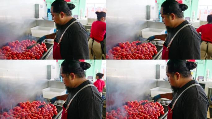 西班牙裔男厨师在开业前烤西红柿