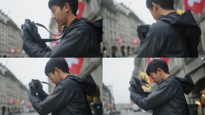 20-30岁的亚洲男性游客，用他们的相机捕捉著名城市里人们的生活方式。
