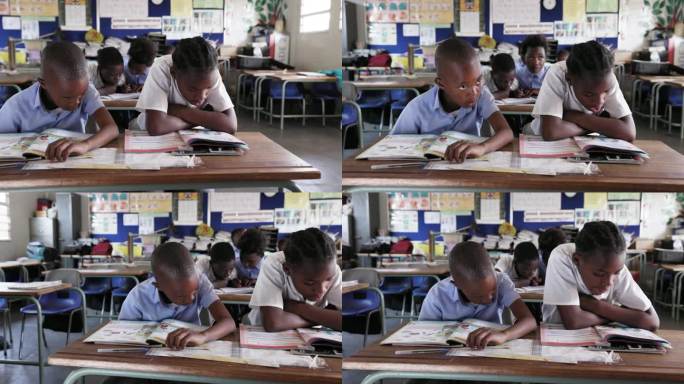 特写镜头。非洲黑人学童坐在课桌前阅读