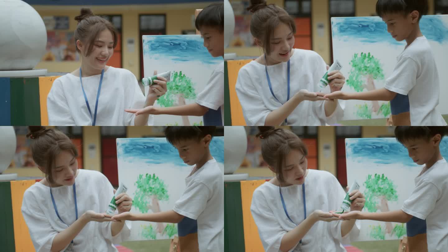 快乐的老师给一幅水彩画
可爱的多民族男孩和女孩在纸上画画在小学。