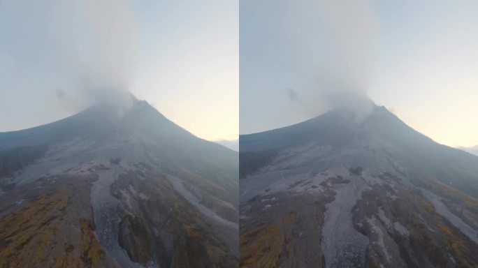 垂直视频。黑色冻结岩熔岩岩浆峡谷脚下火山烟峰