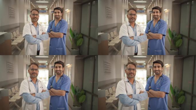 医院中等肖像:两个友好的印度医生看着相机和微笑。成功的医疗保健医生在现代先进的医疗保健设施提供服务