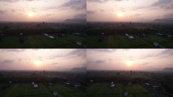 鸟瞰日落和印尼印度教寺庙普兰巴南寺的剪影。