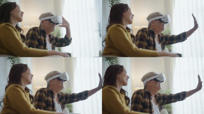 上了年纪的时尚花白头发的男人在客厅里和女儿坐在一起，用头盔应用程序玩模拟虚拟现实VR游戏。