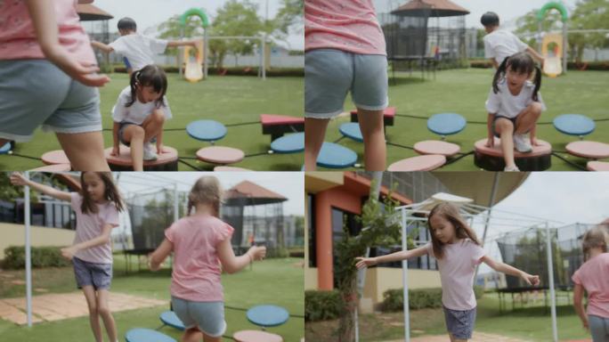 一群快乐的幼儿园小朋友
在阳光明媚的日子里，享受小学的平衡设备。