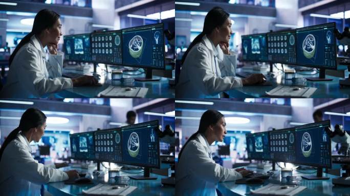 亚洲女性神经学家在现代医学研究中心实验室用台式电脑进行人脑CT扫描。专业医生在3D软件中观察病人的大
