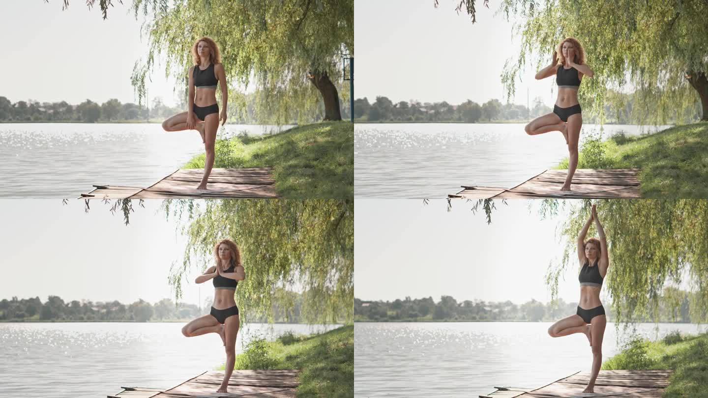 一个女人享受着周围的和平与宁静，沉浸在湖边的瑜伽冥想中。大自然是她在户外瑜伽练习的灵感和力量来源。