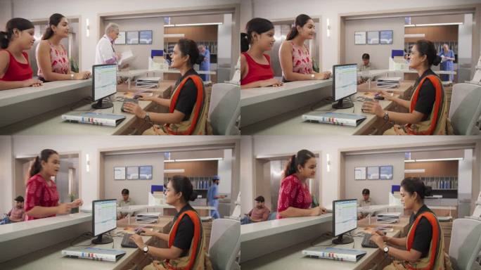 在一家现代化的当地医院里，印度接待员在绿屏电脑上工作并与病人交谈的肖像。女性卫生保健工作者制定就诊时