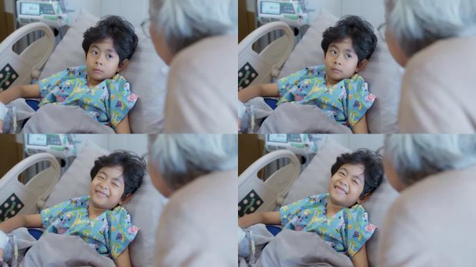 放松的年轻亚洲病人躺在医院的床上和奶奶聊天