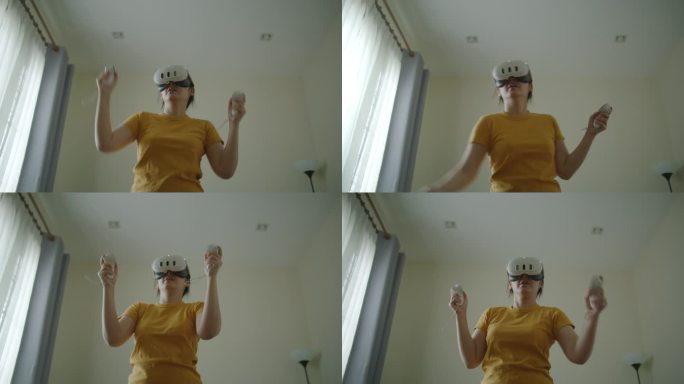 女子在家玩VR眼镜游戏