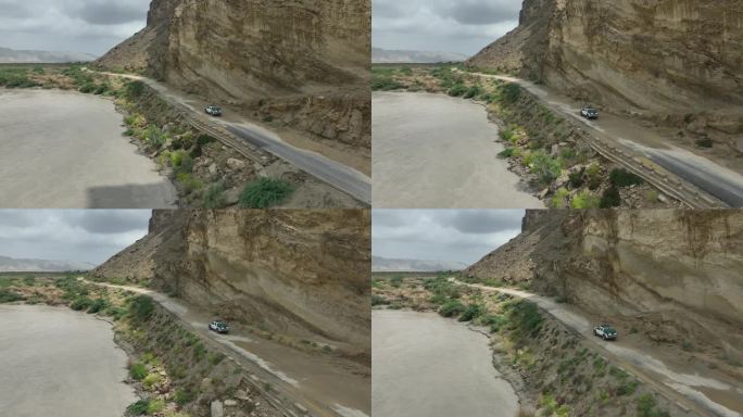 一辆吉普车行驶在美丽而危险的道路上，在巴基斯坦俾路支省欣戈尔探索道路