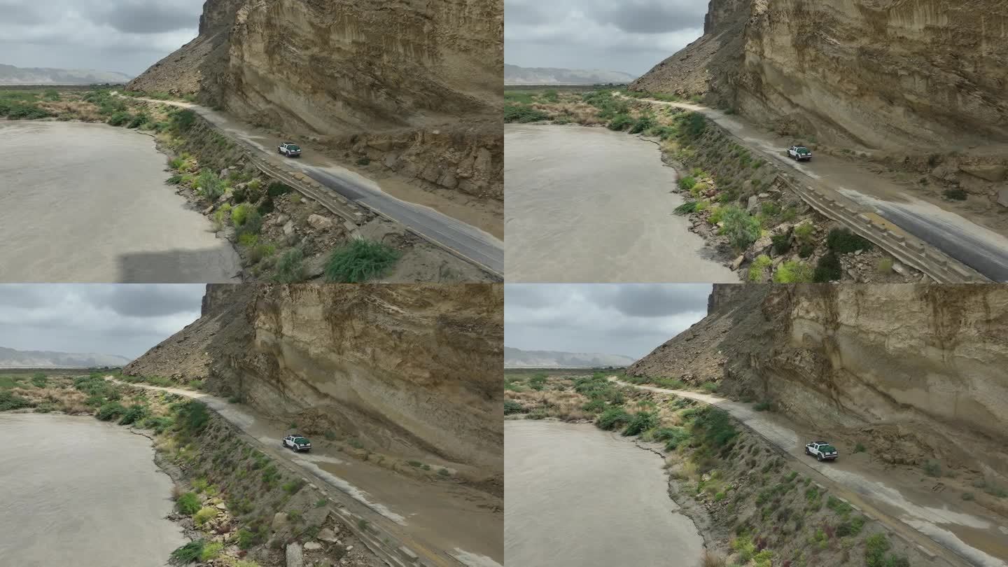 一辆吉普车行驶在美丽而危险的道路上，在巴基斯坦俾路支省欣戈尔探索道路