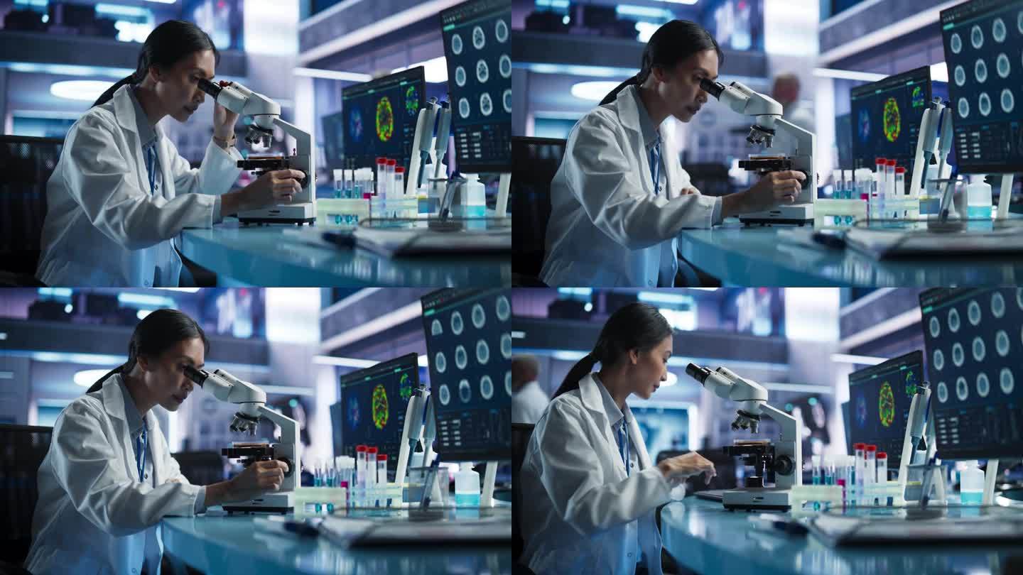 医学研发中心:亚洲女科学家用显微镜分析培养皿样品。为中风患者的康复开发创新药物的专家。