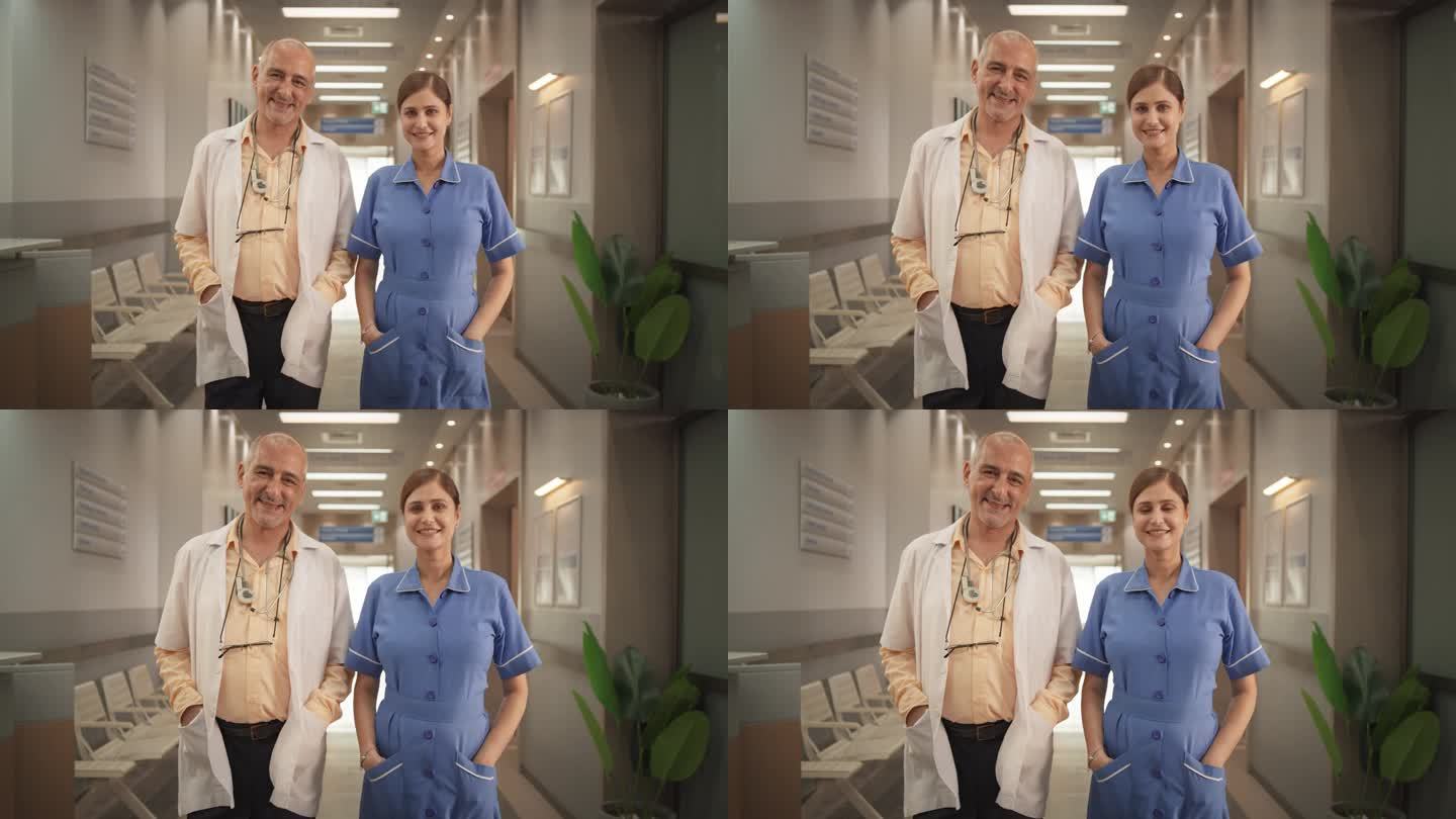 两位友好的印度医生和护士:一男一女成功的医疗保健专业人员站在现代医院办公室，摆姿势，看着镜头，微笑的