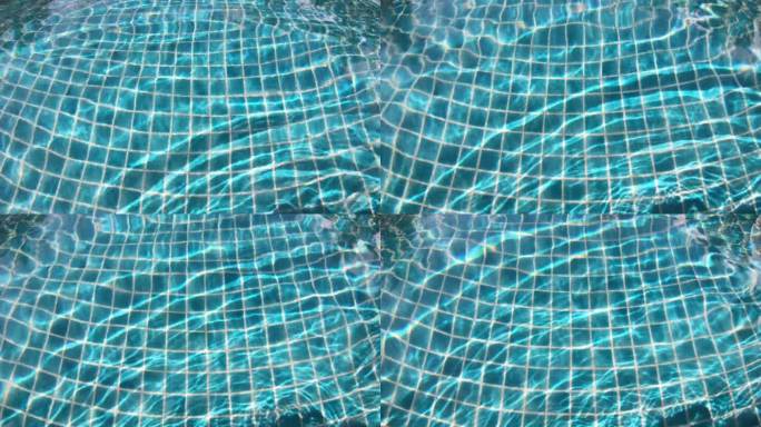 泳池湛蓝透明的水面泛起涟漪，近距离拍摄4K动态场景
