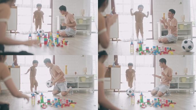 亚洲男孩踢球和破坏玩具木块。和家人一起玩