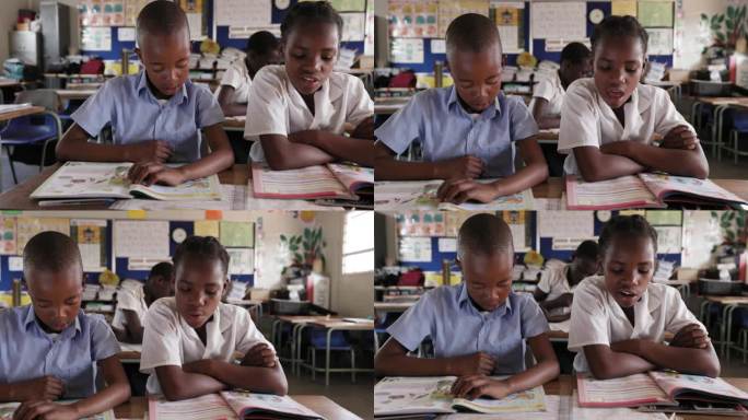 特写镜头。非洲黑人学童坐在课桌前阅读