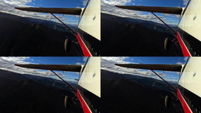 飞机在风景优美的山脉中飞行的镜头