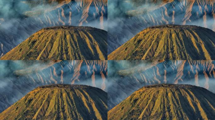 航拍无人机拍摄的日出场景，火山喷发的烟雾被云雾包围。Bromo, sememeru, Batok和W