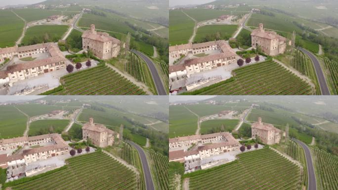 空中-美丽的别墅庄园在意大利被雄伟的葡萄园，教堂和城堡包围